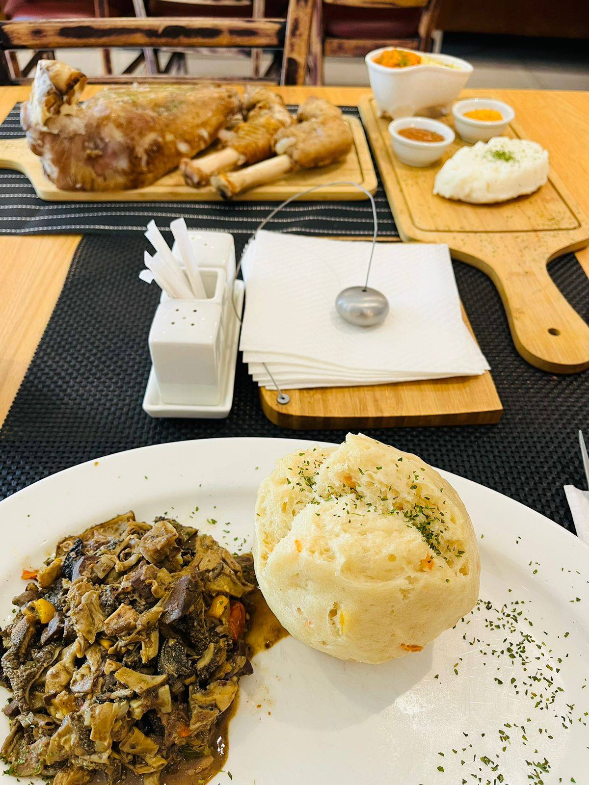 Slow-cooked lamb shank with dombolo