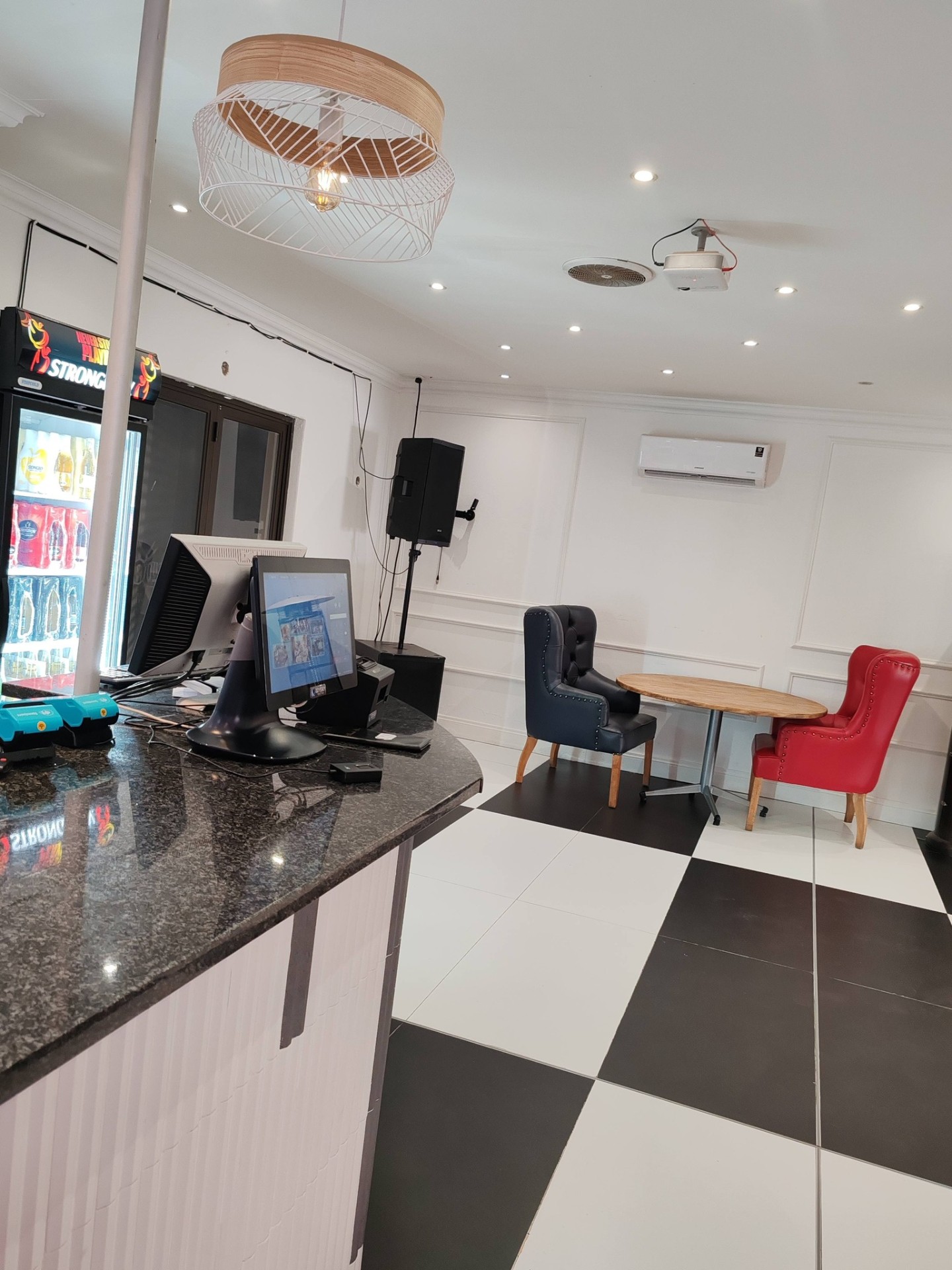 Checkered floor reception and bar entrance