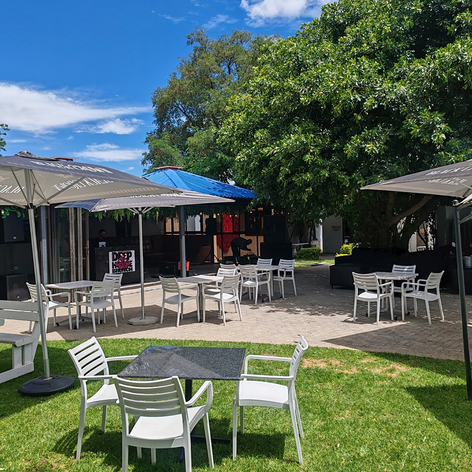 Garden tables under Jameson umbrellas